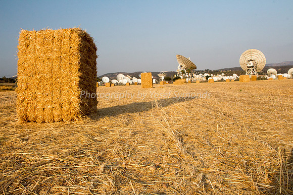 Haystacks in Field - Satellite Dishes in Background 170721-3