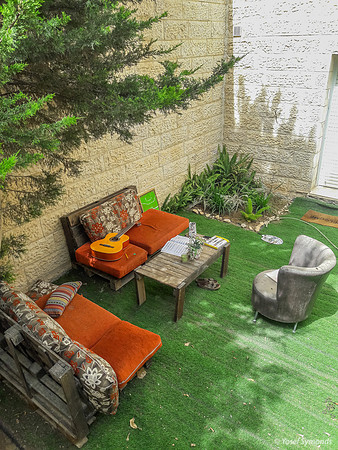 Teenage Girl Organizes Her Relaxation in Family's Outside Garden 2