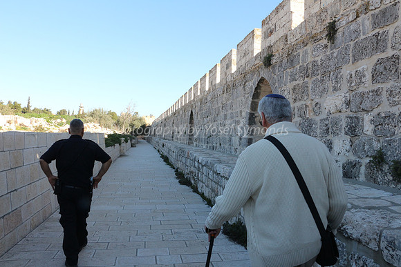 Policeman Leading Group along Eastern Perimeter