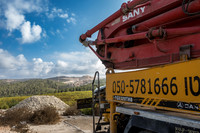 Construction Vehicle and Quarry in Background 231019-4