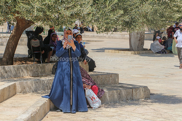 Young Arab Lady Photographing Jewish Visitors