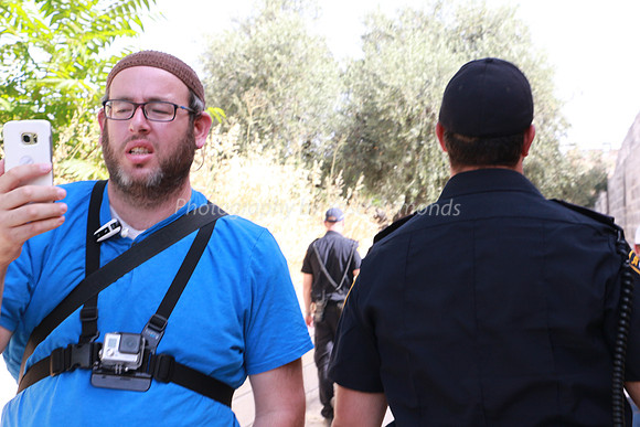 Police and Group Leader Facing Opposite