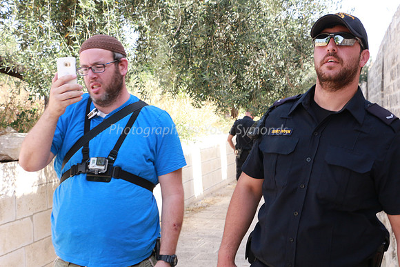 Police and Group Leader Facing Same