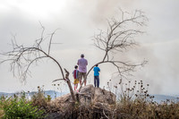 Family Observing Fire in Valley 3