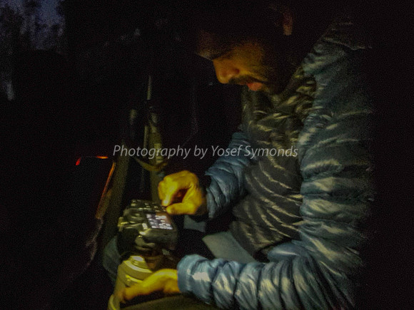 Photographer Working in the Dark of Predawn