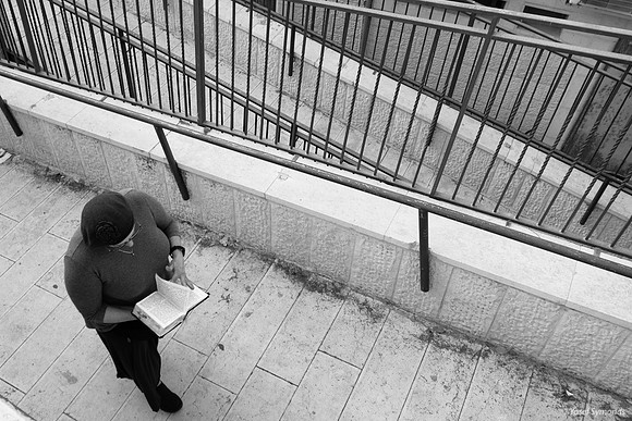Woman Praying as She Walks