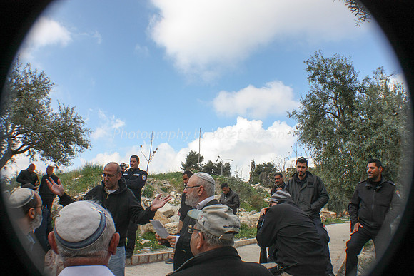 Wakf Smiles as Cohen Explains to People about Blessing