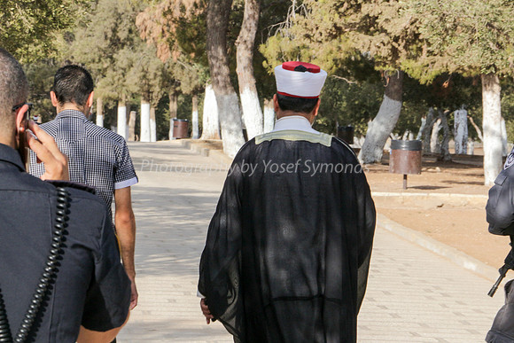 Distinguished Person  Heading West Overtakes Jewish Group