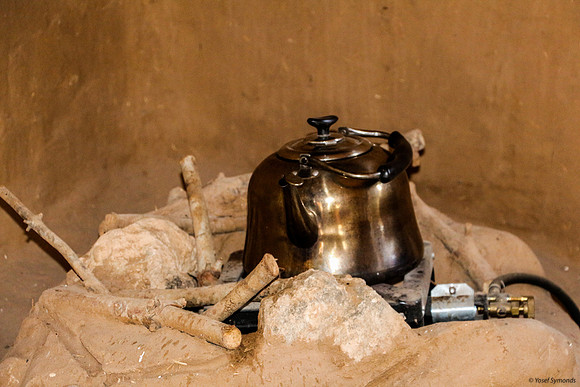 Boiling water on gas fireplace in Beta Israel Village