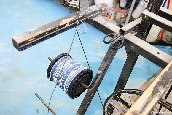 Spindle of Techelet and White Thread on Cutting Frame 5