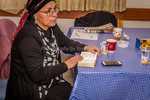 Women Praying at Table