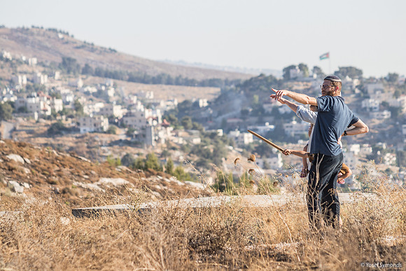 Pointing Away from Palestinian Flag On Hill Opposite 210621-1