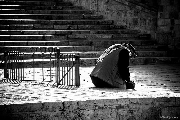 Seated Arab Man Crouched Over 1