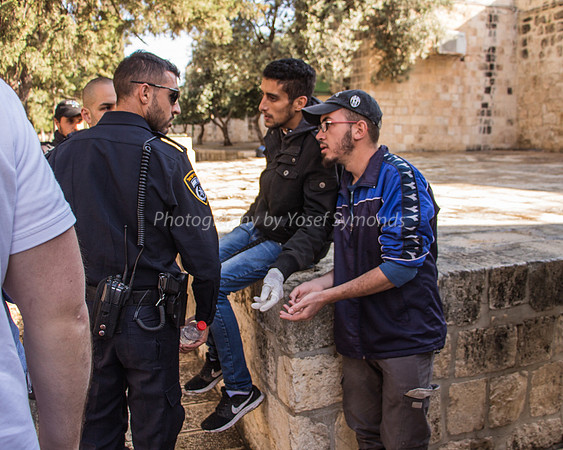 Arab Bystanders Being Told Not to Encroach on Pathway