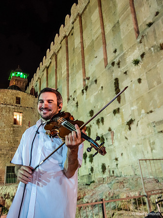 Fiddling in Front of Entrance Wall Maarat Hamachpelah 130718-1