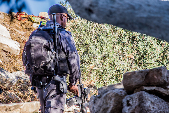Policeman Moving Parallel to Visitors