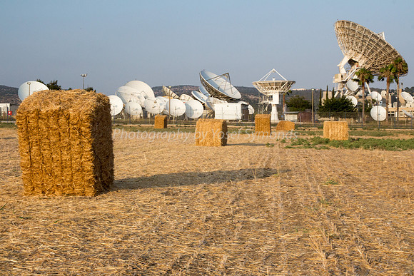 Haystacks in Field - Satellite Dishes in Background 170721-5