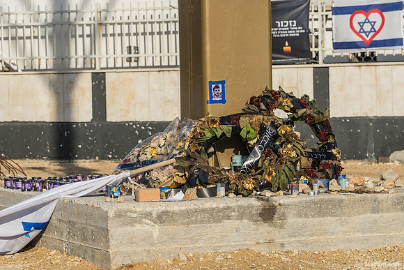 Wreaths and Candles At Police Station Site 240219-12