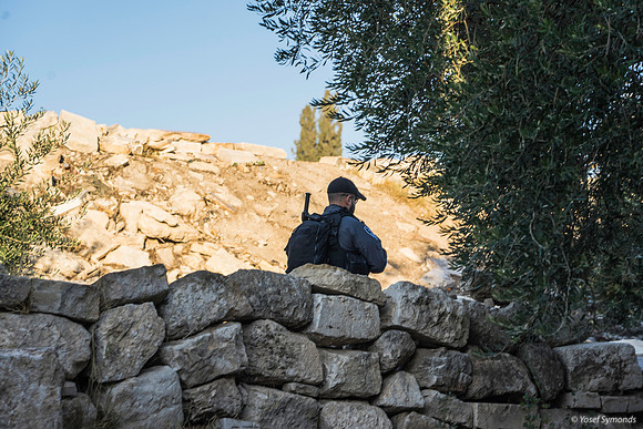 Policeman Guarding the Group from the Inside of Path 191205-1