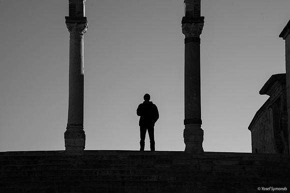 Silhouette of Man Under Stone Archway 191205-2