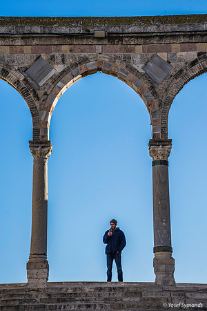 Man Under Stone Archway 191205-4