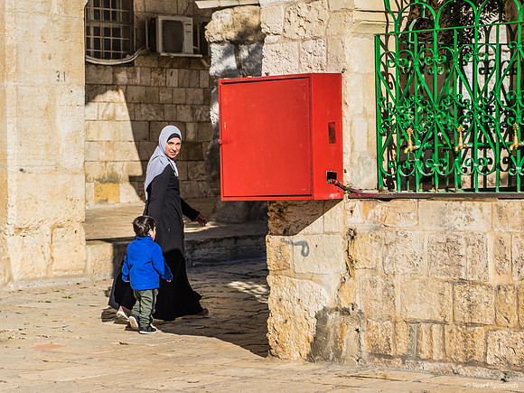 Young Arab Mother Walking Her Son 200303-1