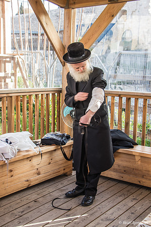 Rav Elboim Laying Tefillin as Preparing to Pray 190313-15
