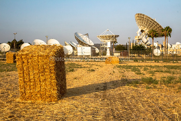Haystacks in Field - Satellite Dishes in Background 170721-11