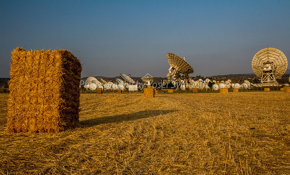 Haystacks in Field - Satellite Dishes in Background 170721-4