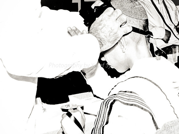 Adjusting Strap of Barmitzvah Boy