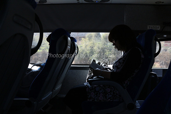 Lady Praying on Bus 2