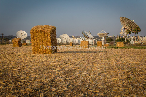 Haystacks in Field - Satellite Dishes in Background 170721-7