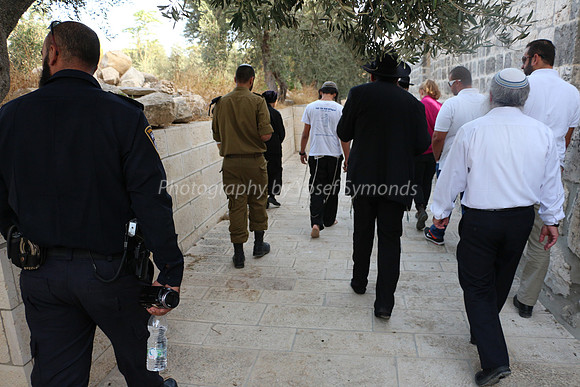 "Mixed Multitude" Followed by Policeman