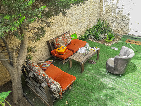Teenage Girl Organizes Her Relaxation in Family's Outside Garden 1