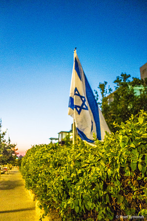 Israel Flag with Nahar Hayarkon Boulevarde in Background 190819-5
