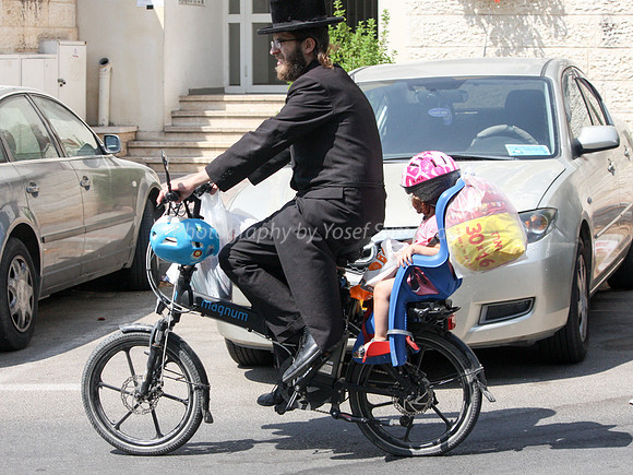 Hareidi Father Cycling with Daughter 1