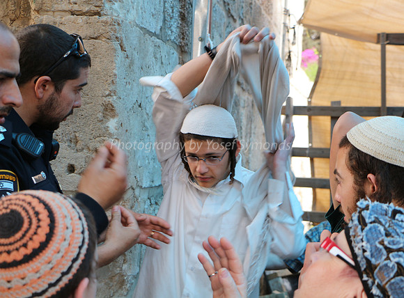 Off Comes Outer Shirt  at Mugrabi Gate Entrance to Har Habayit