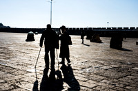 Rabbi and Man with Walking Sticks Heading Off into Sunrise 190212