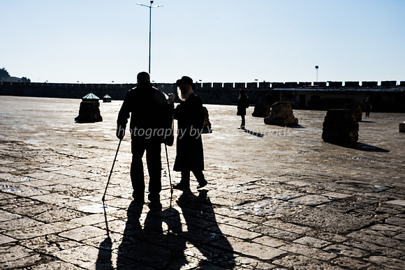 Rabbi and Man with Walking Sticks Heading Off into Sunrise 190212