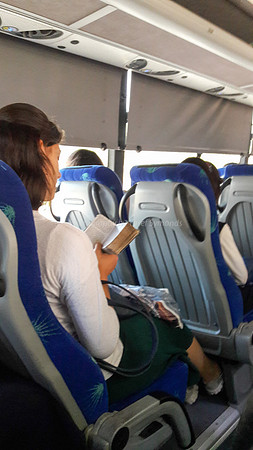 Lady Praying on Bus 1
