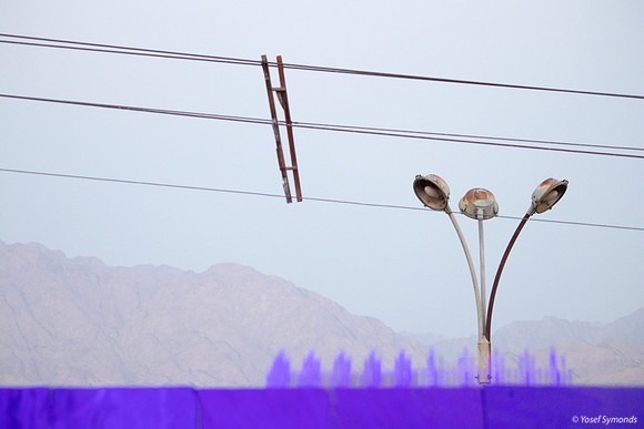Pigeon Spikes, Electricity Line Spacer, Street Lights and Jordanian Mountains