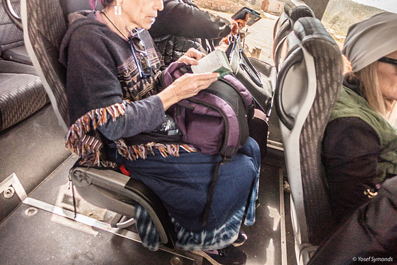 Woman Praying On Bus 250330-2