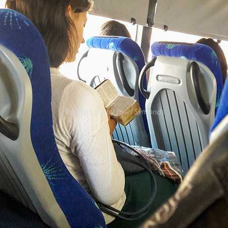 Lady Praying on Bus 3
