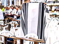 Boy Folding His New Tallit at Kotel 190509-1