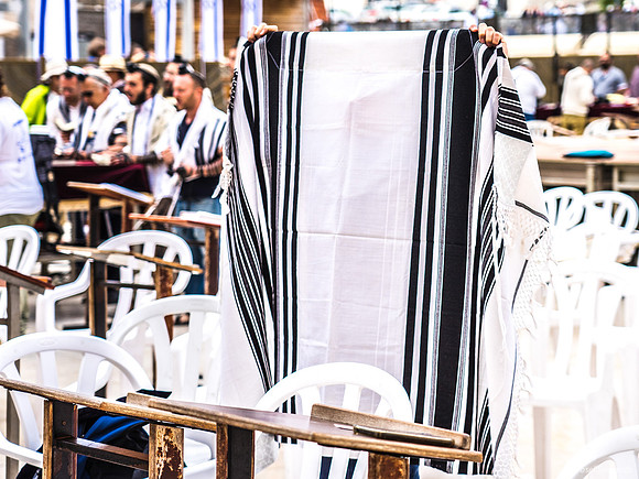 Boy Folding His New Tallit at Kotel 190509-1